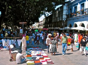People strolling; vendors selling