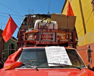 IMG_0218crop Protest sign with red flags on trash collector's truck.