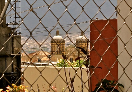 Santo Domingo through chain-link fence.