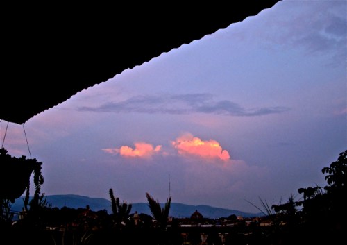 Pink clouds against purplish-blue sky