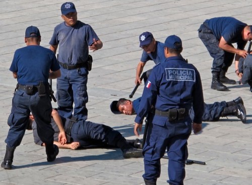 Oaxaca Municipal Police practicing subduing techniques.