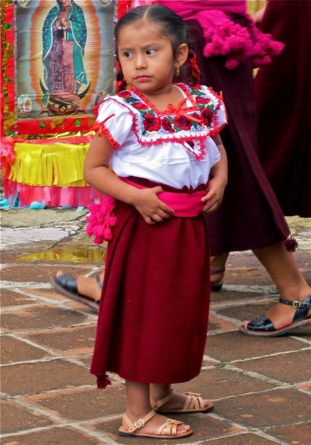 Very young Zapotec girl in traditional dress.