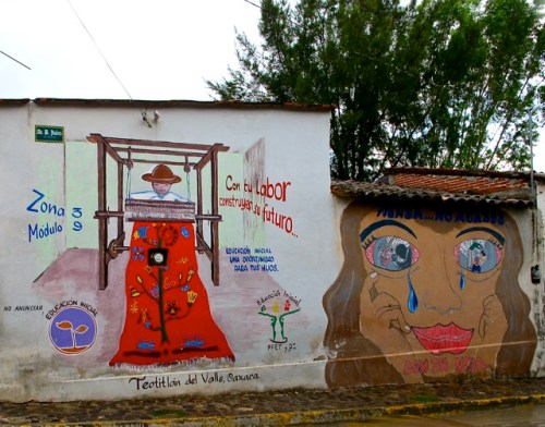 Weaver at loom painted on side of building: 