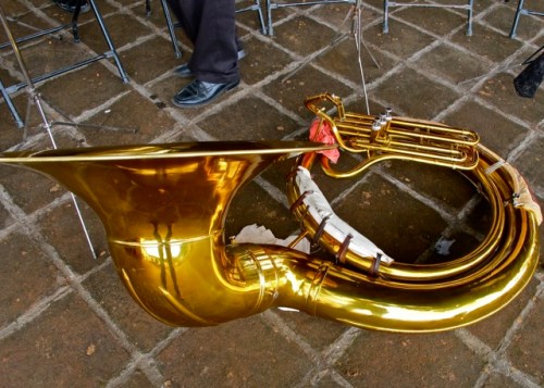 Tuba laying on the ground.