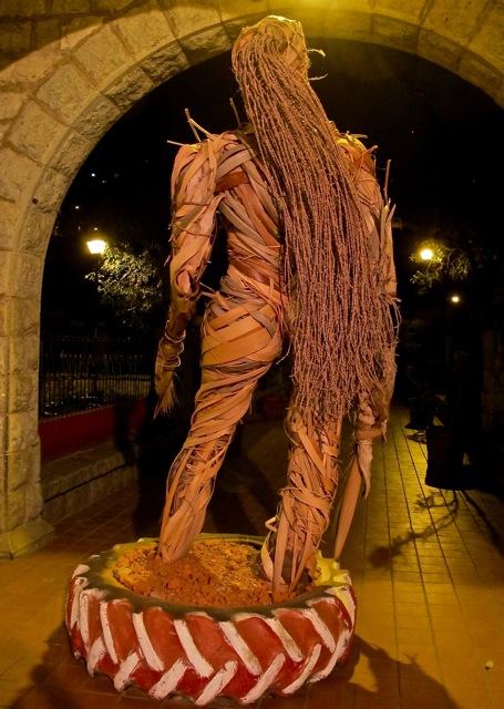 Back view of palm leaf female sculpture