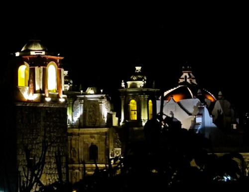 Bell tower of Church of San José and bell tower, facade, and dome of Basílica de la Soledad