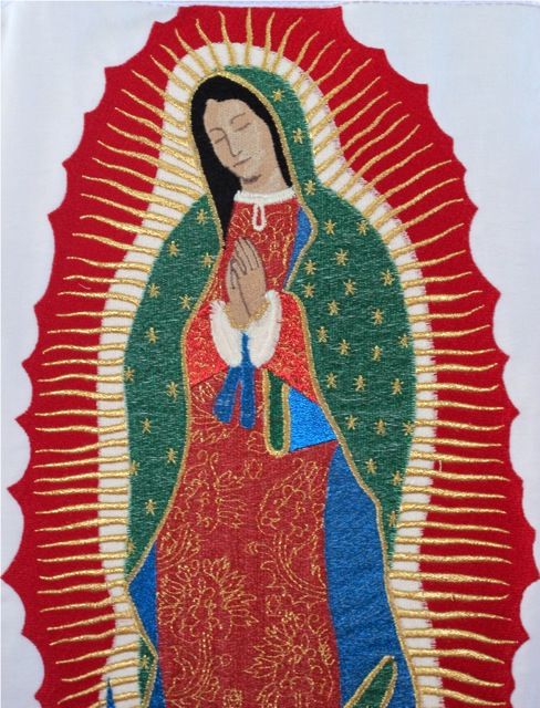 Closeup of the Virgin of Guadalupe on the back of Moctezuma's cape.