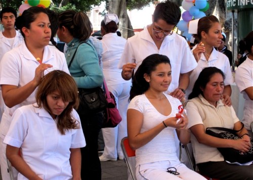 Nurses giving head massages with a battery powered massager