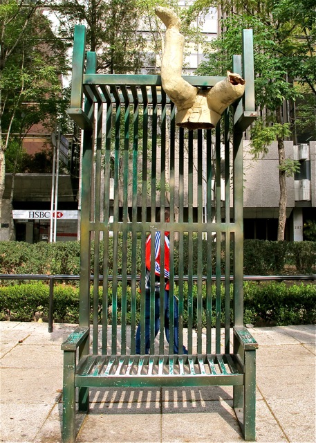 IMG_2048 Green metal bench with bottom of torso with legs "seated" on top.