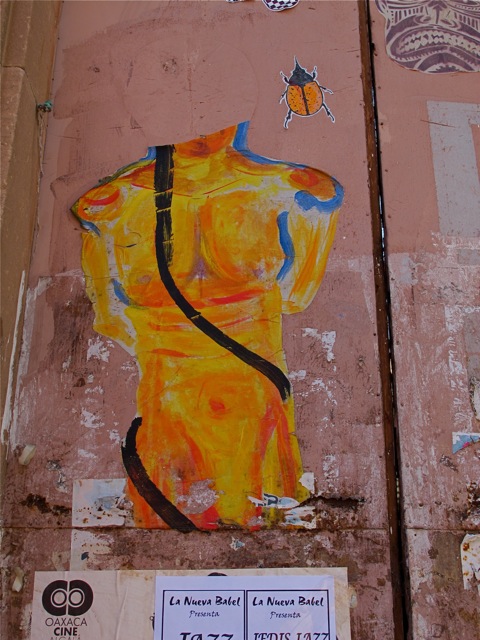Male torso in yellows and reds with a little blue and black