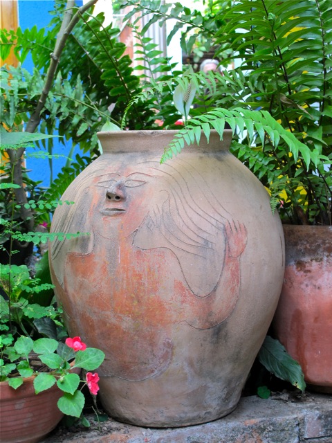 Urn with the face of a woman.