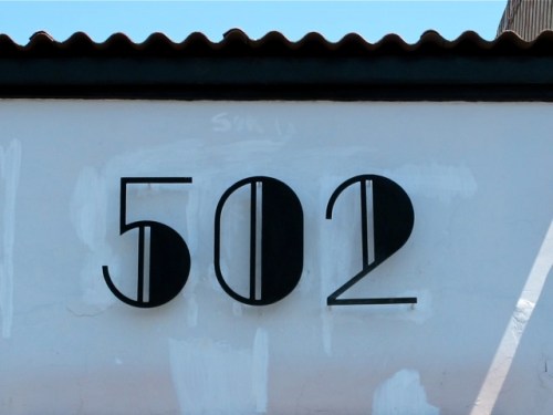 Black Art Deco 502 against white wall