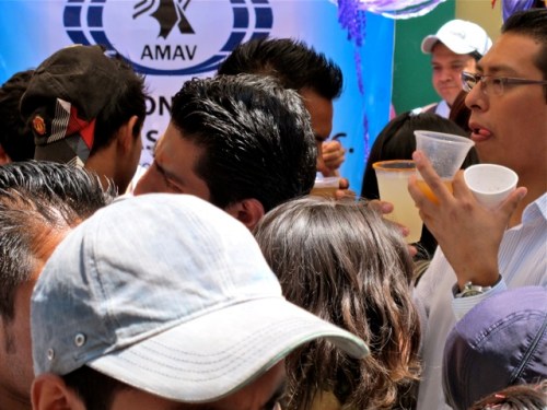 Crowd of heads and cups