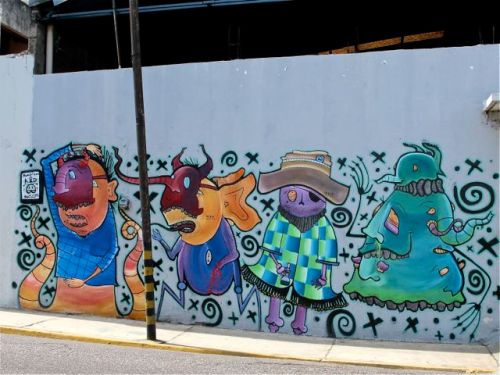 Colorful street art mural of imaginary characters