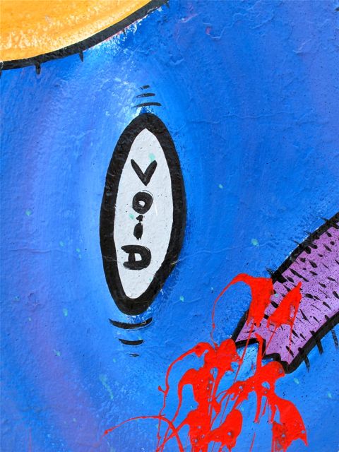 Close up of mural with the word "void" written vertically in an oval.