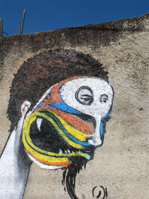 IMG_2219 Closeup of colorfully painted face on wall