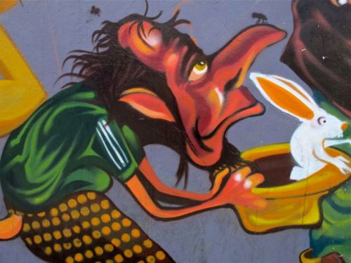 Creature with long nose with rabbit in hat