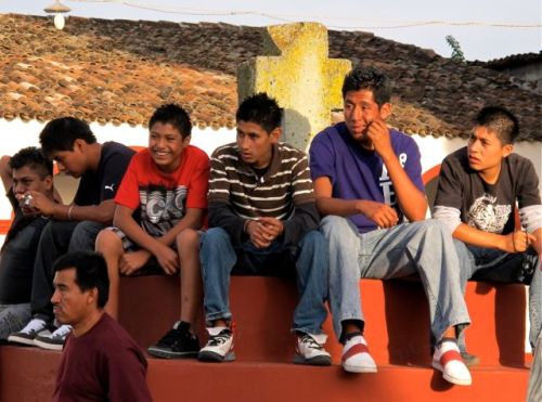 Young men sitting on a ledge