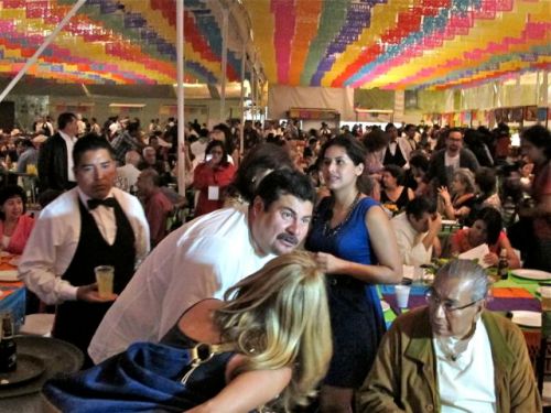 Chef Alejandro Ruiz Olmedo talking to a table filled with people.
