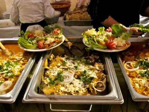 Serving pans of food.