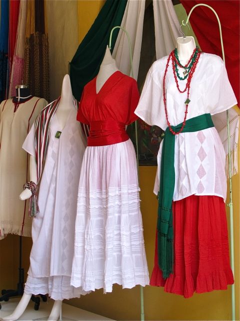 Green, white, and red dresses, skirs, blouses, and sash.