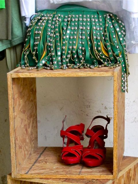 Green purse and red shoes.