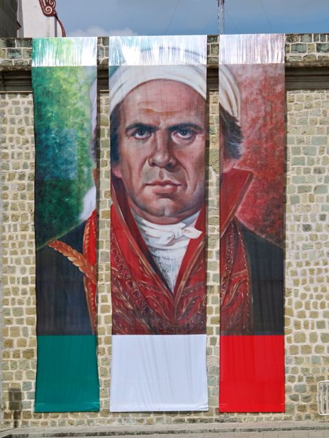 Massive 3-piece banner portrait of Morelos hanging from wall of Oaxaca's Municipal Building