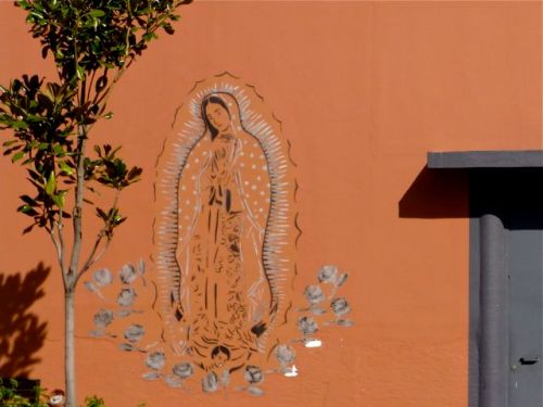 Virgin of Guadalupe image stenciled on a wall