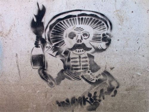 Black and white skeleton face with mustache