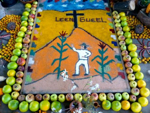 Sand painting surrounded with apples