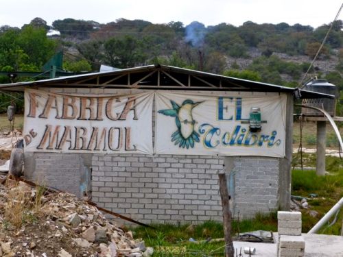 Concrete block building with sign, Fabrica Marmol, El Colibrí