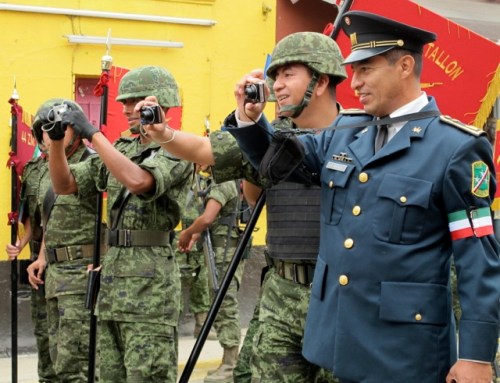 Men in military uniforms taking photos