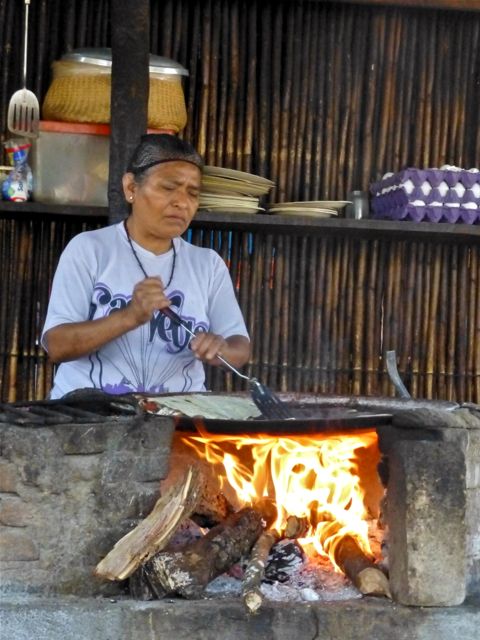 Woman cooking on comal