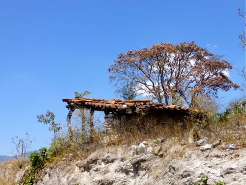 Tile roof lean-to on rocky outcrop