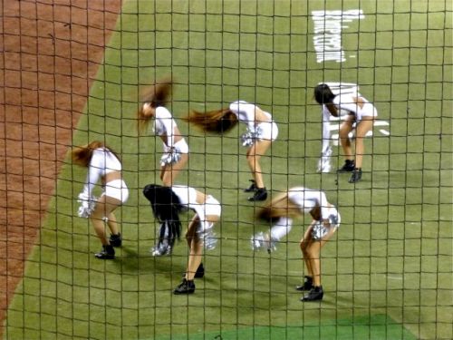 Cheerleaders tossing their hair