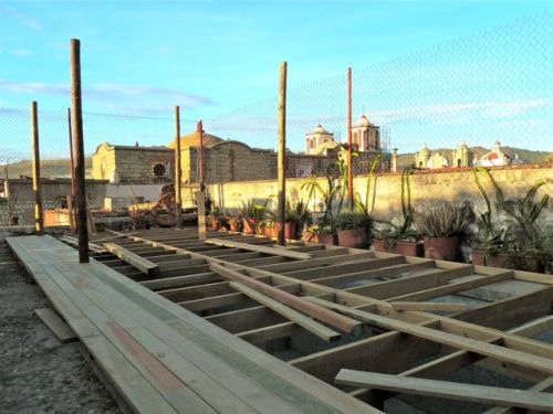 Deck being constructed over empty pool