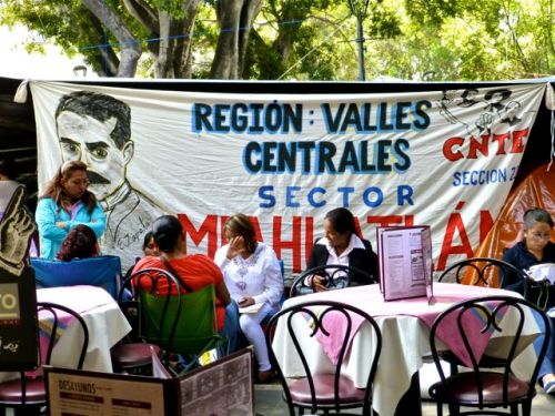 Restaurant tables and chairs and teachers union banner