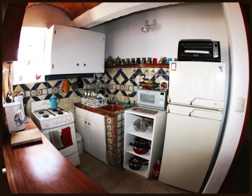 Kitchen with white cabinets and appliances