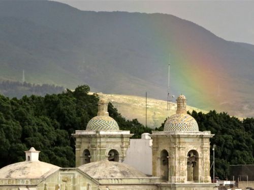 Rainbow over bell towers of San Felipe Neri