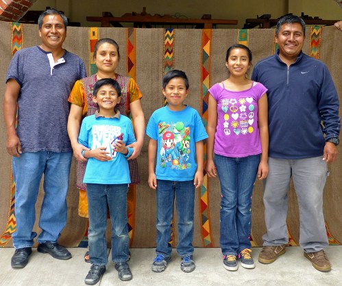 Antonio Ruiz Glz. and family standing in front of rug
