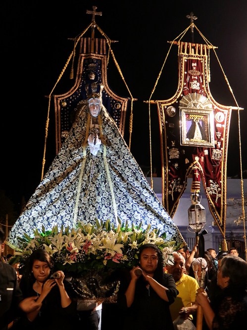 Virgen de la Soledad image carried by women