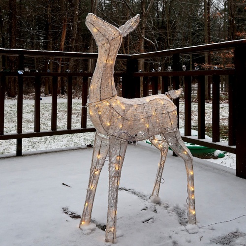 Lighted reindeer in snow